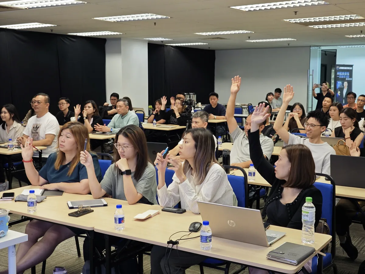 Participants raising hands during the interactive session