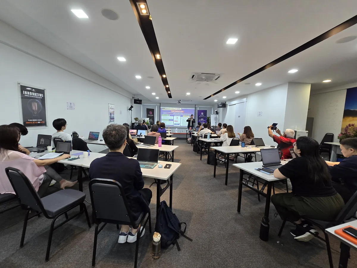 Agents following the session on their laptops