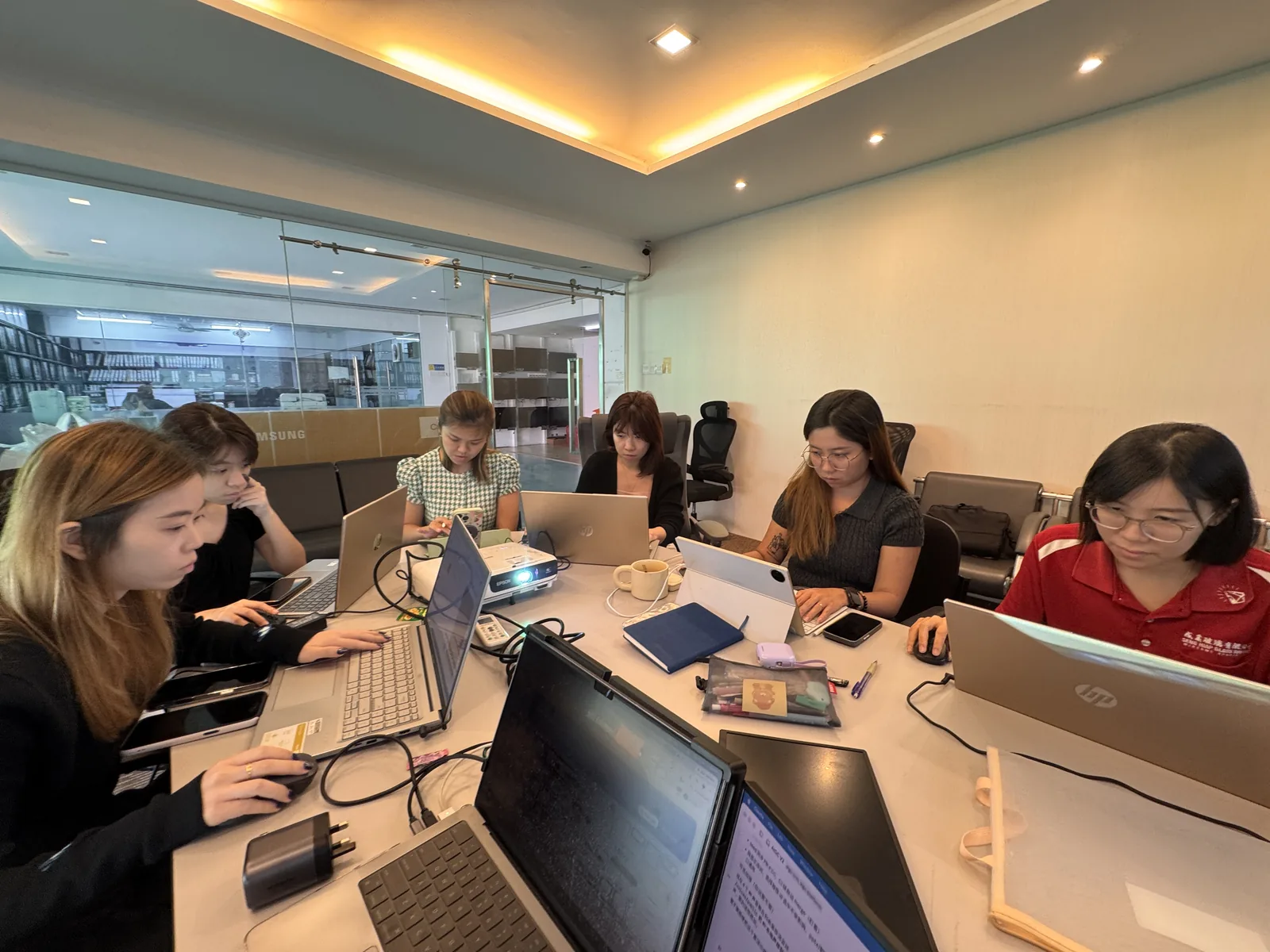 Havona Hotel team working on laptops during the AI Video Creation training