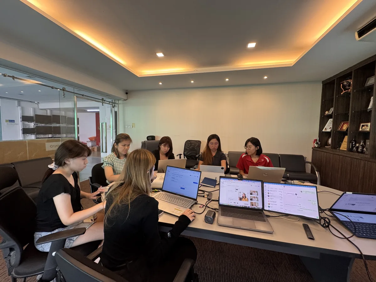 Havona Hotel team members practising AI video creation on their laptops