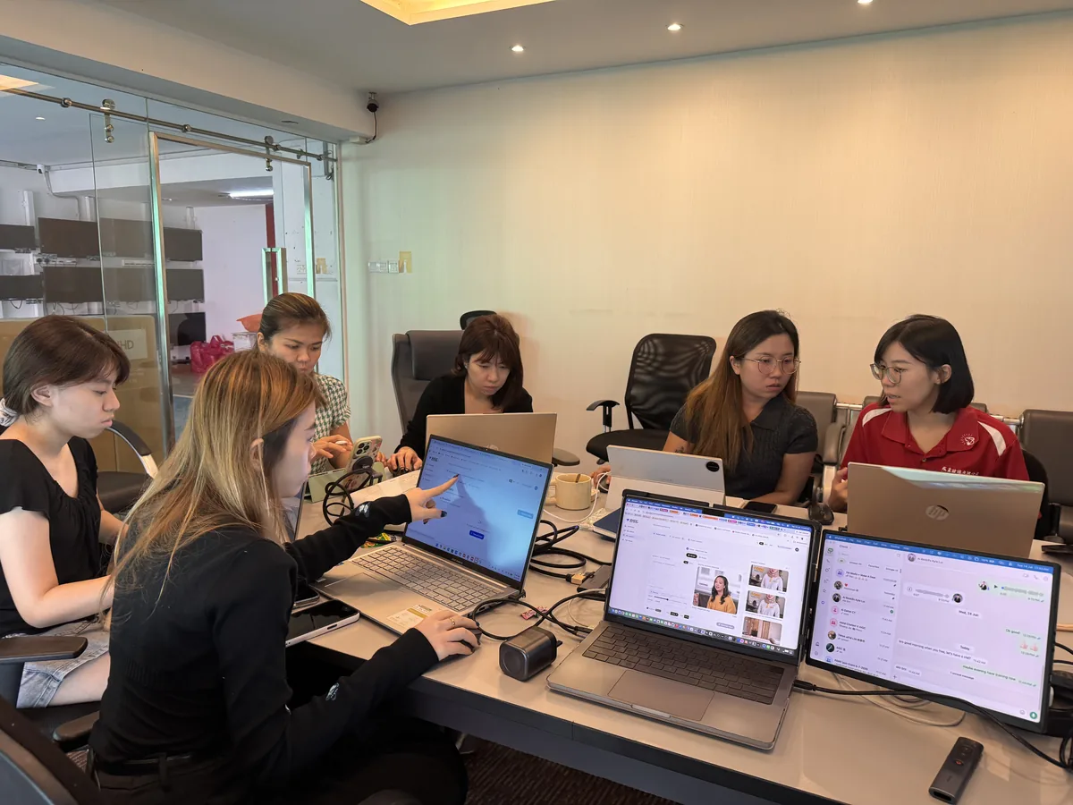 Trainer guiding the Havona Hotel team hands-on with AI video tools