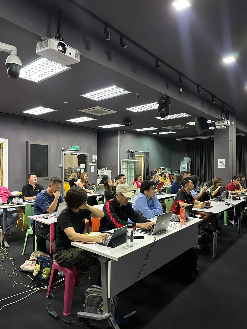 IQI property agents practising hands-on AI video creation during the AIGC Malaysia training