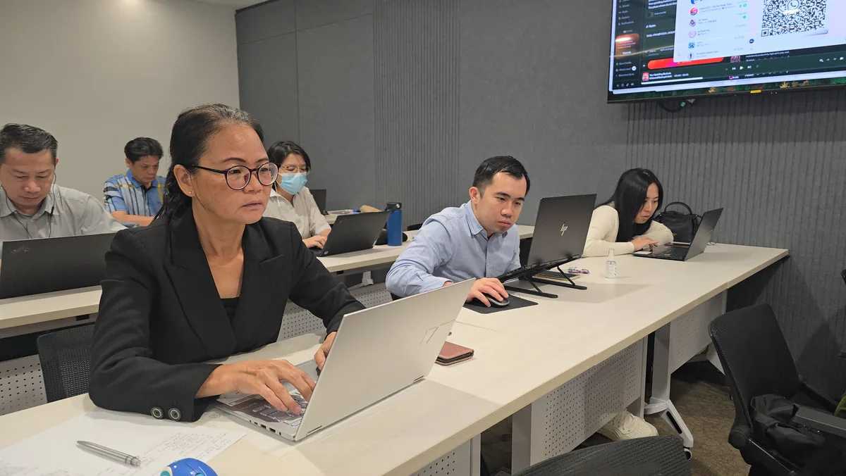 Participants from Malaysian companies following the AI content creation exercise