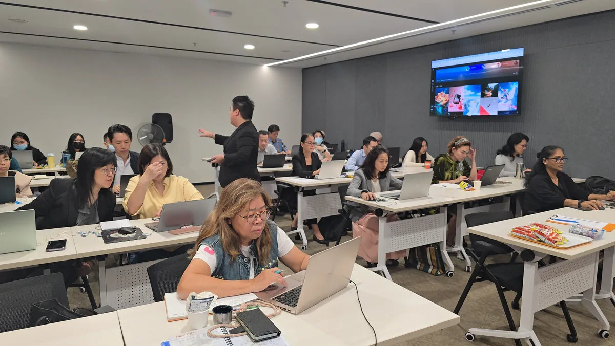 Full room of company participants at the MPC AI training session