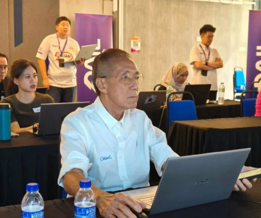 A senior participant creating his first AI video at the workshop